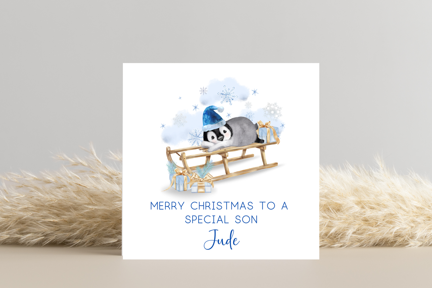 Personalised Penguin Sledging Christmas Card