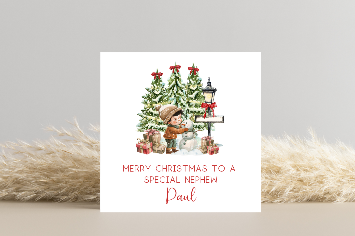 Personalised Snowman Building Little Boy Christmas Card