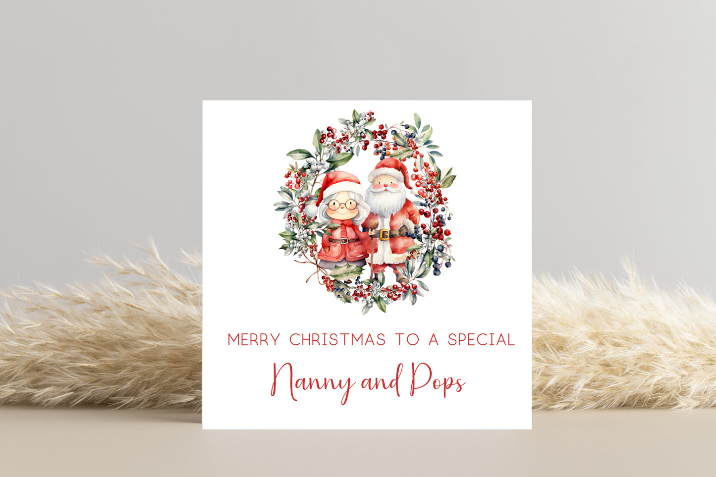 Personalised Santa and Mrs Claus in Wreath Christmas Card