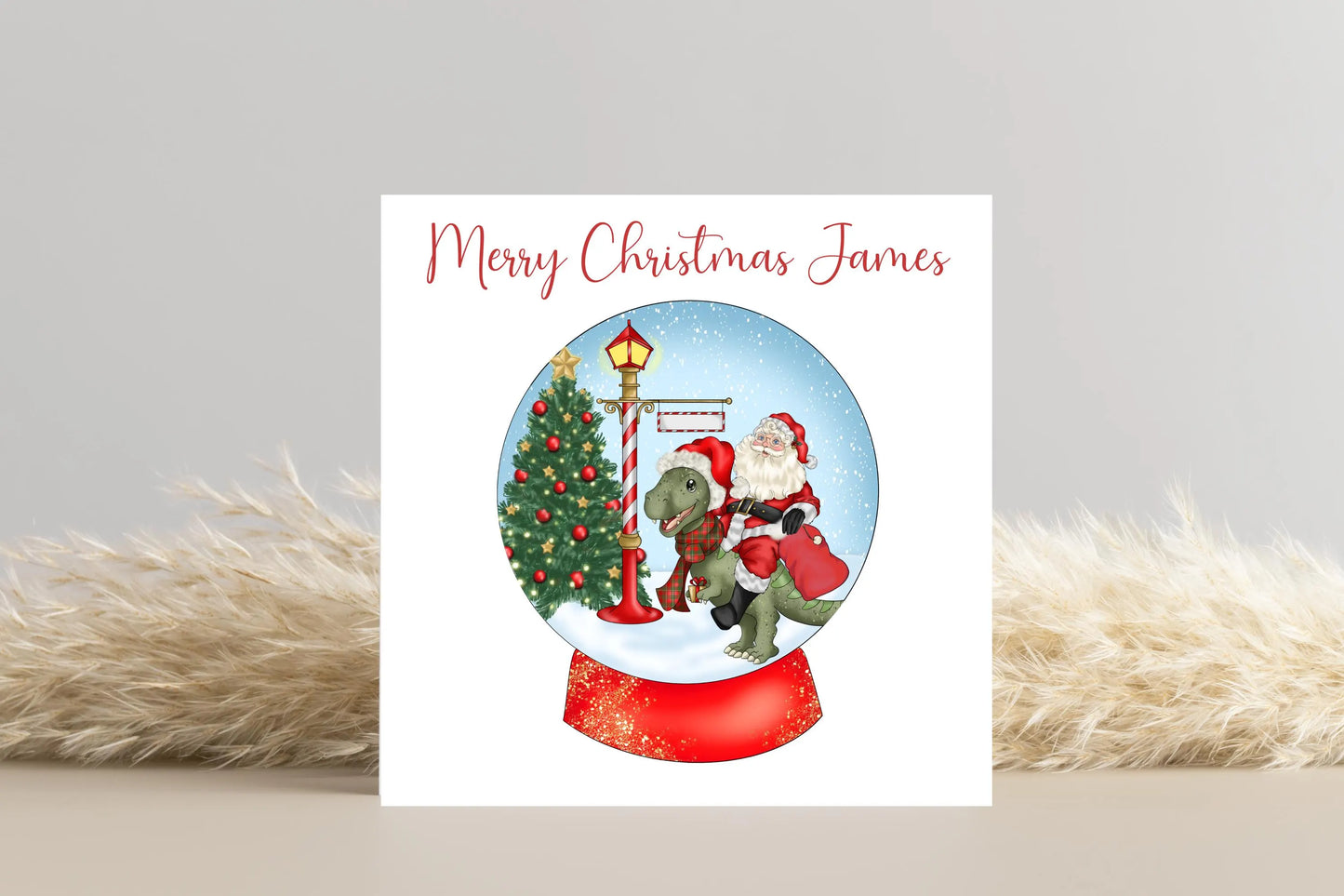 Santa riding a Dinosaur in a Snow Globe Christmas Card- Personalised